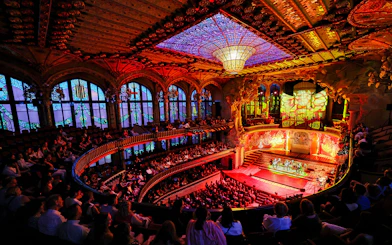 Flamenco performance on stage at Palau de la Música, Barcelona, with audience in attendance.