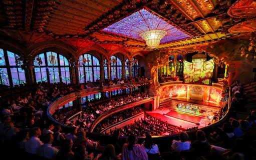 Flamenco performance on stage at Palau de la Música, Barcelona, with audience in attendance.