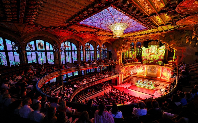 Flamenco performance on stage at Palau de la Música, Barcelona, with audience in attendance.