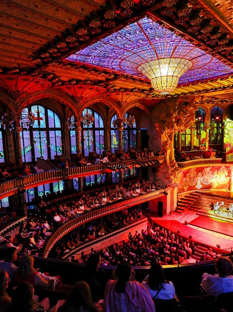 Flamenco performance on stage at Palau de la Música, Barcelona, with audience in attendance.