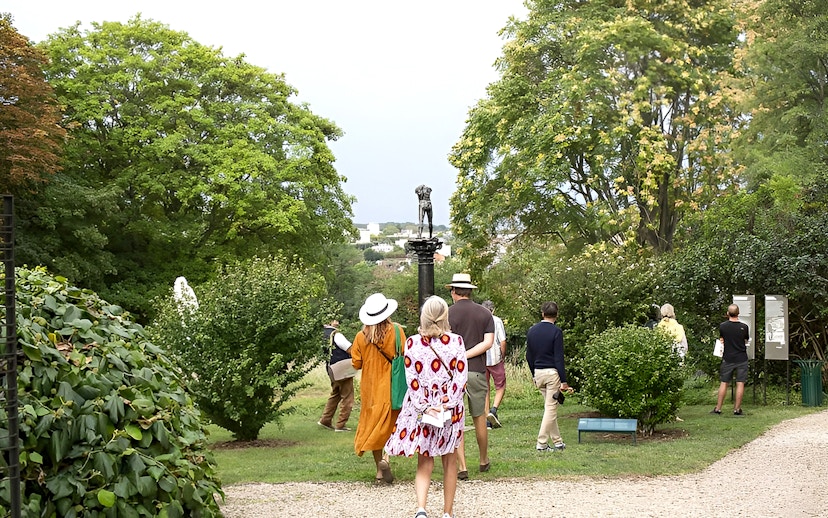 Visitors walking through Rodin Museum gardens on a private guided tour.