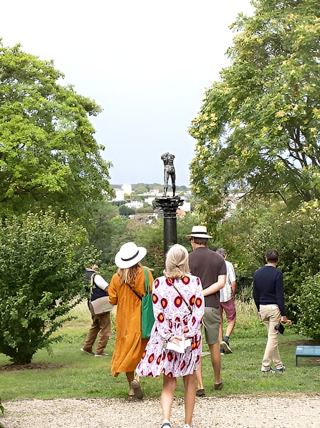 Visitors walking through Rodin Museum gardens on a private guided tour.