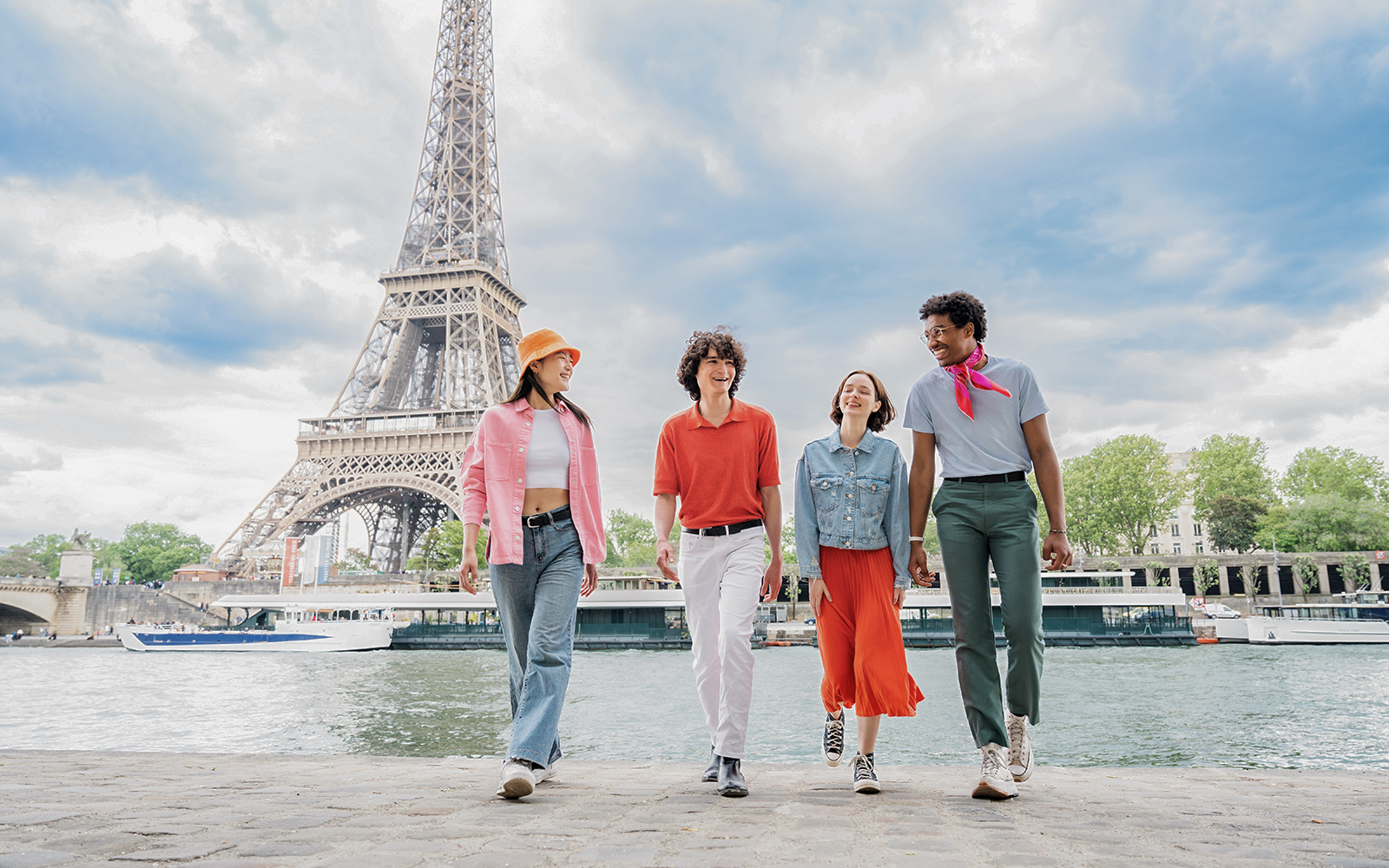People walking near Eiffel Tower in Paris, France.
