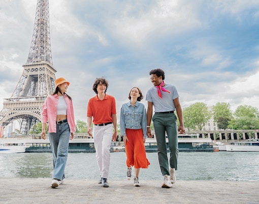 People walking near Eiffel Tower in Paris, France.