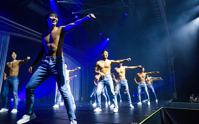 Performers dancing on stage during Wild Wild Show in Korea.