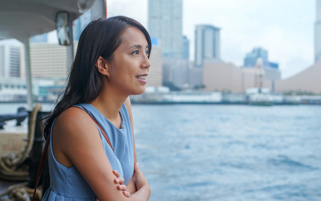 Traveler enjoying view on Cotai Ferry from Hong Kong to Macau.