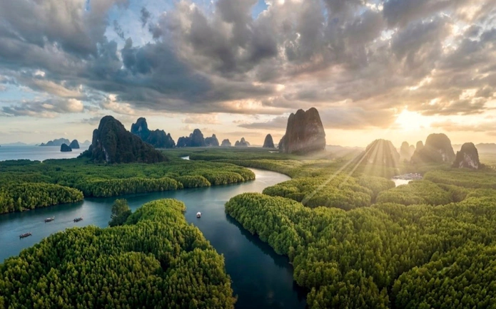 James Bond Island with limestone cliffs and lush greenery, Phang Nga Bay, Phuket.