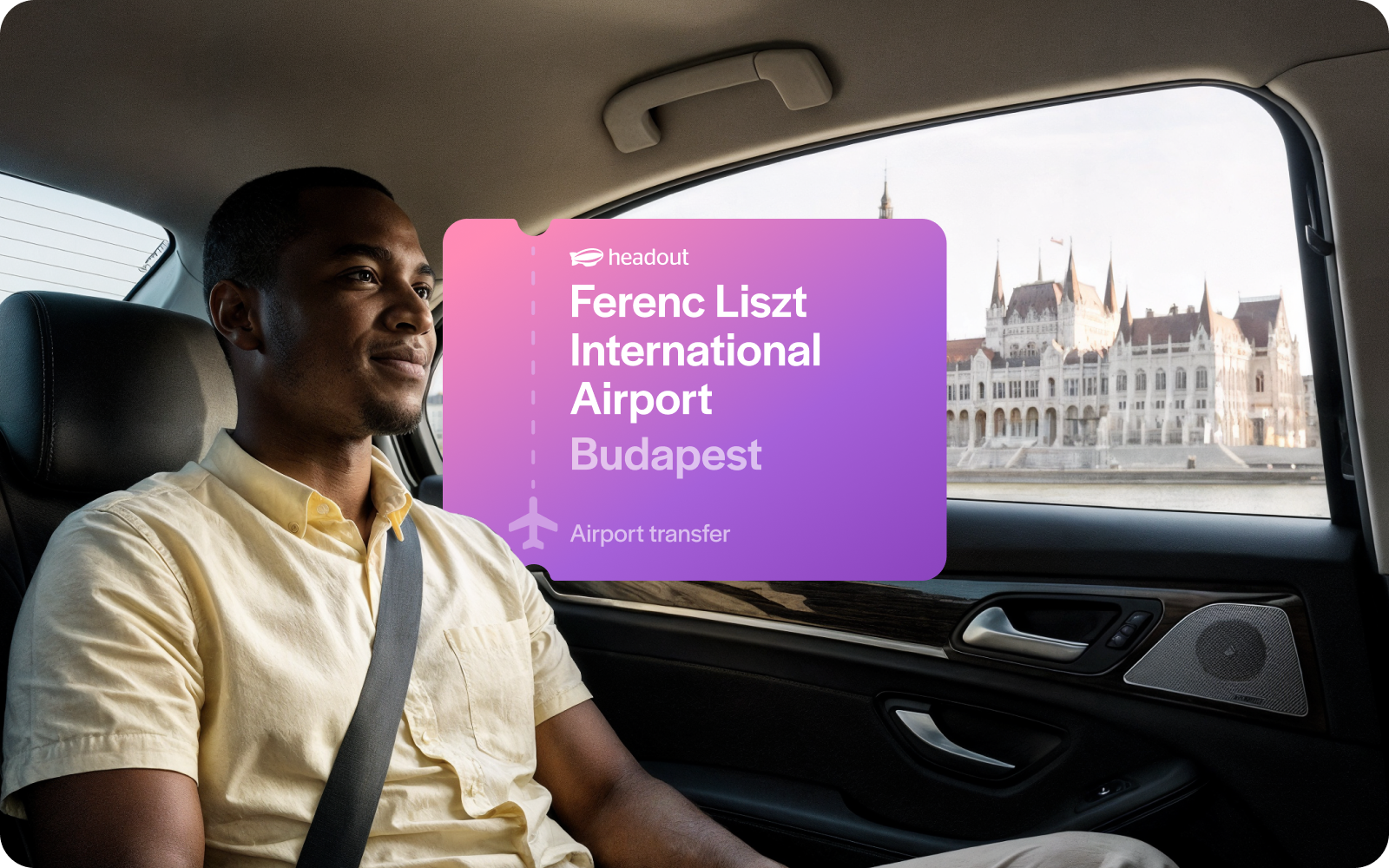 Private transfer passenger in car with Budapest Parliament view.