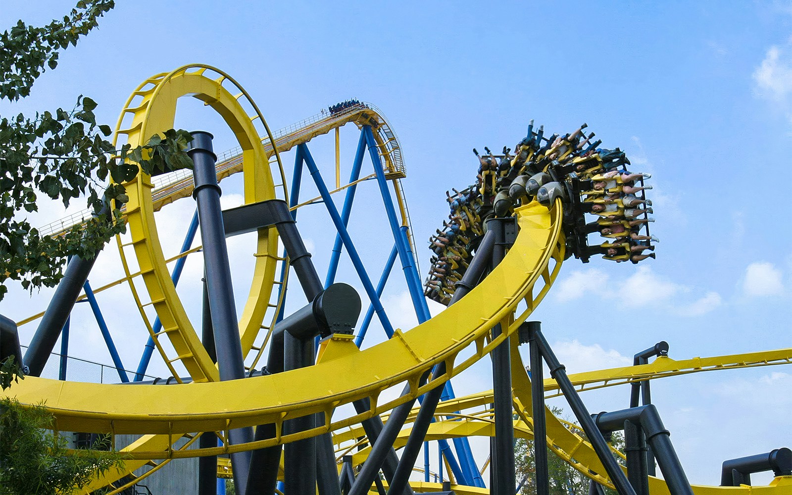 Roller coaster loop at Six Flags Great Adventure, BATMAN™ The Ride, with riders upside down.