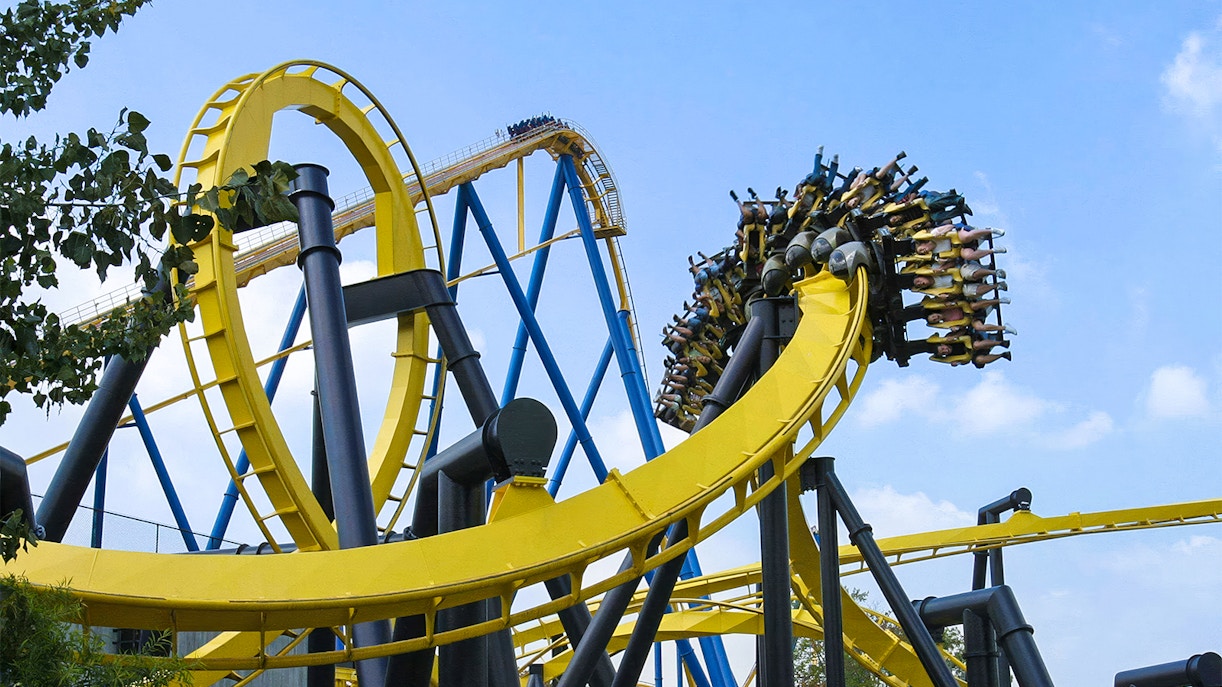 Roller coaster loop at Six Flags Great Adventure, BATMAN™ The Ride, with riders upside down.