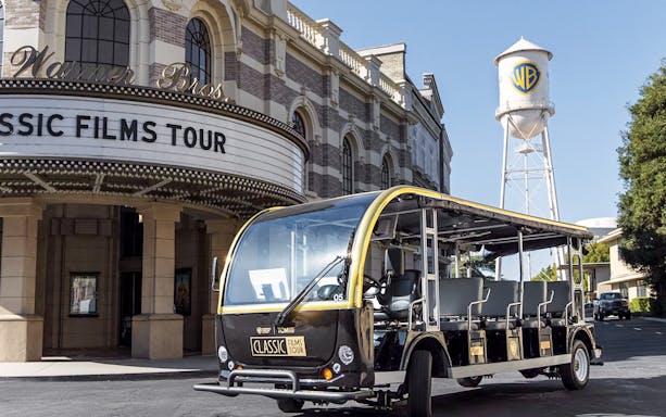 Warner Bros. Studio tour tram in front of Classic Films Tour entrance, Hollywood.