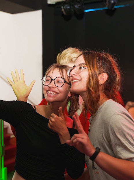 Visitors taking a selfie with wax figures at the National Wax Museum.