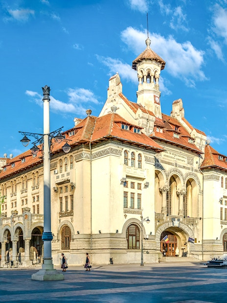 Archaeology museum building in Constanta, Romania with clear blue sky.