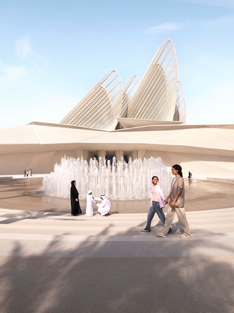 Main entrance of Zayed National Museum with fountain and palm trees, Abu Dhabi.