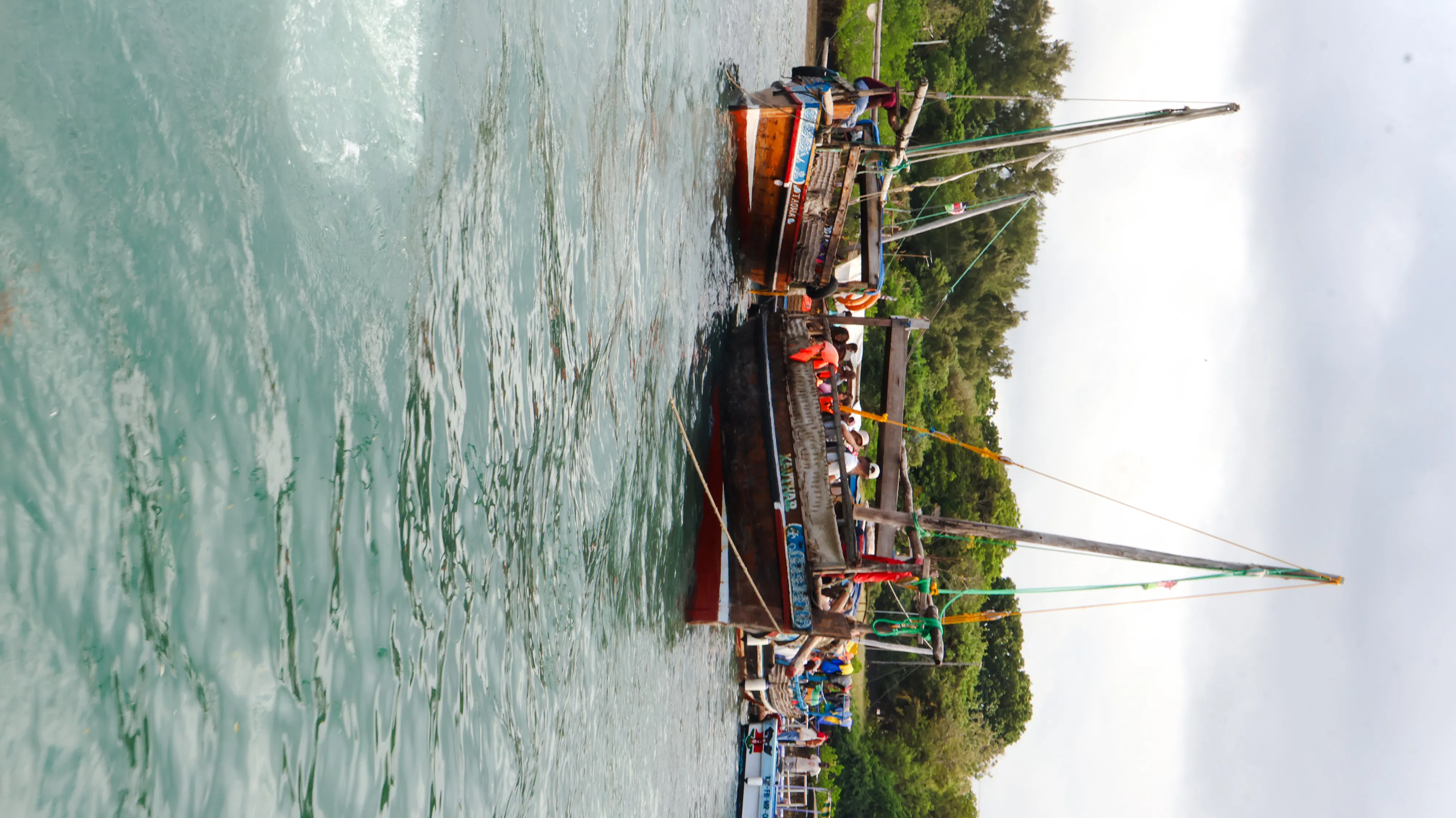 Traditional dhow boat with tourists on Wasini Island tour, Diani Beach.