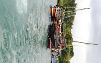 Traditional dhow boat with tourists on Wasini Island tour, Diani Beach.