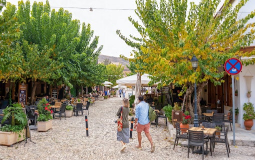 Pedestrian street with cafes and trees in Troodos village, Cyprus, part of the Paphos tour.