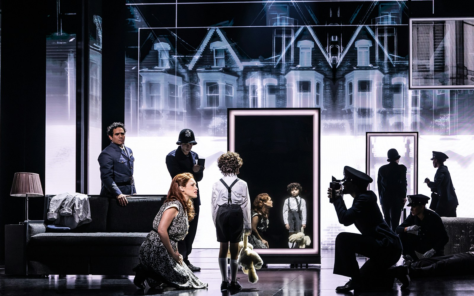 Stage scene from The Who’s Tommy musical with characters in front of a mirror.