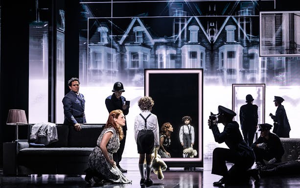 Stage scene from The Who’s Tommy musical with characters in front of a mirror.