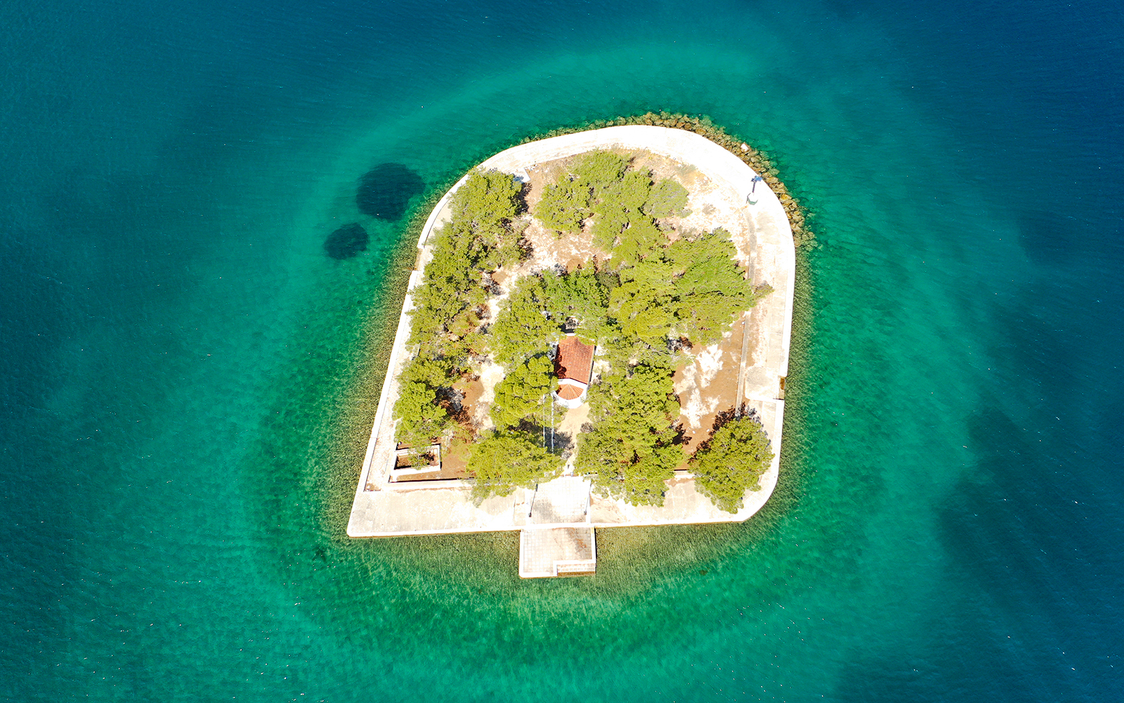Aerial view of Lazarato Island surrounded by turquoise waters, Ithaca Cruise, Kefalonia, Greece.