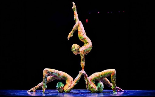 Acrobats performing a balancing act at Cirque du Soleil Kooza, Singapore.