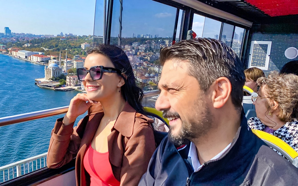 Hop-on hop-off bus tour with view of Bosphorus and Istanbul skyline.