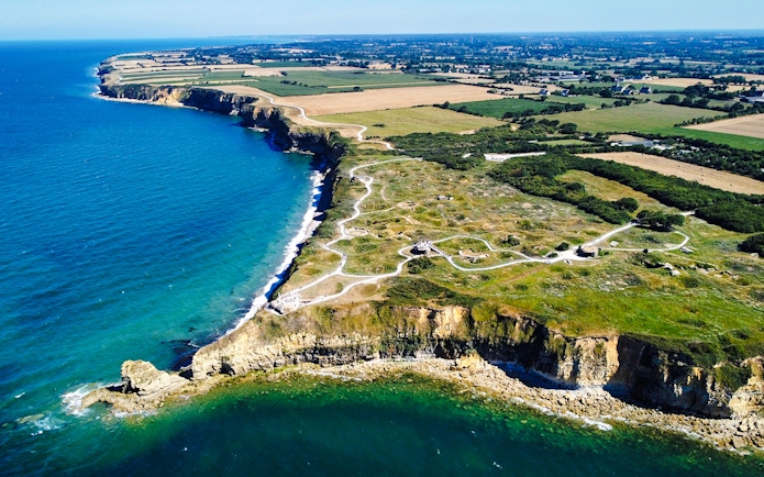 Aerial view of Pointe du Hoc cliffs and Ranger Monument, Normandy coastline.