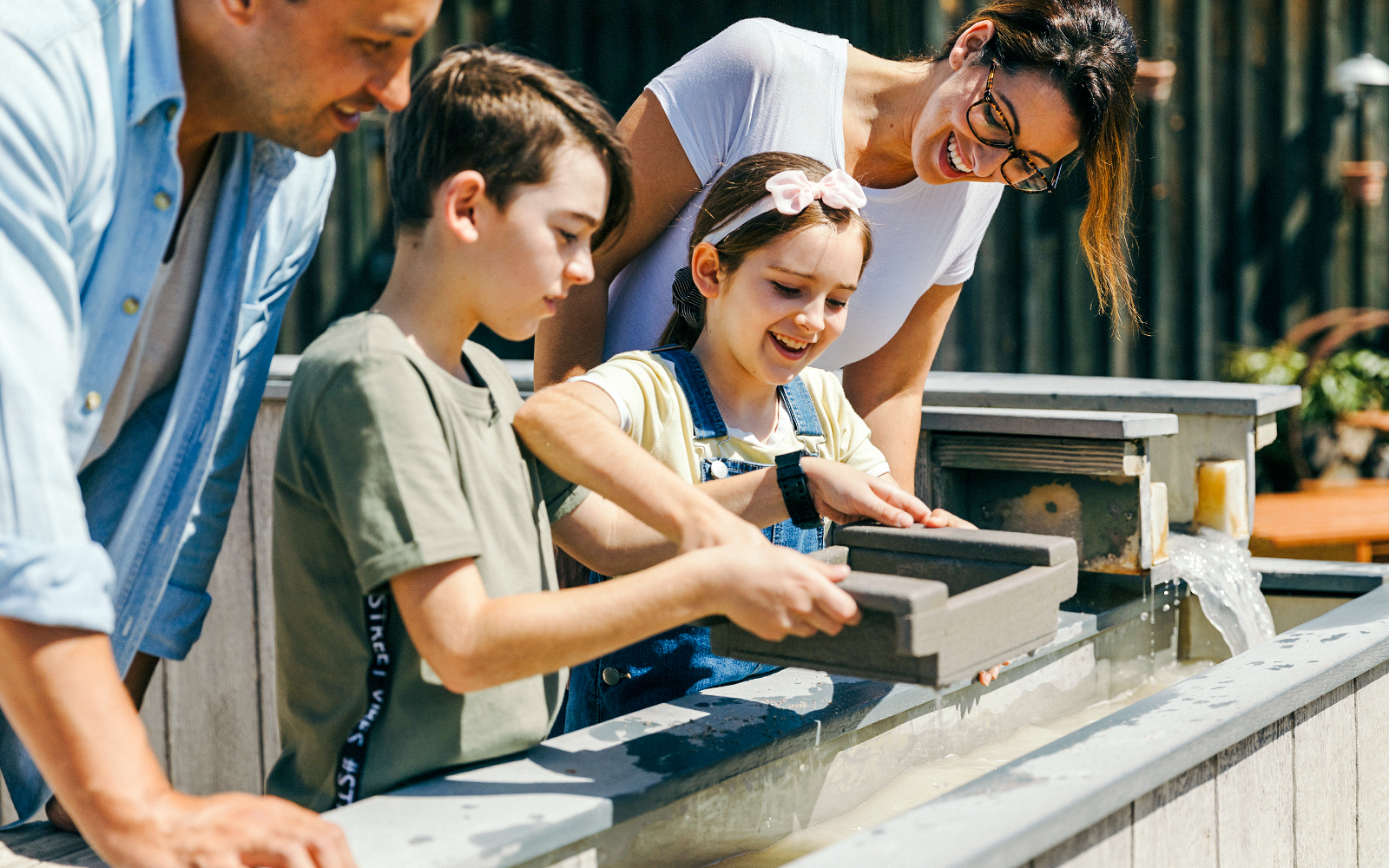 Children panning for gold at Paradise Country, Gold Coast.