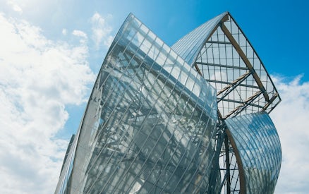 Fondation Louis Vuitton building with glass panels in Paris.