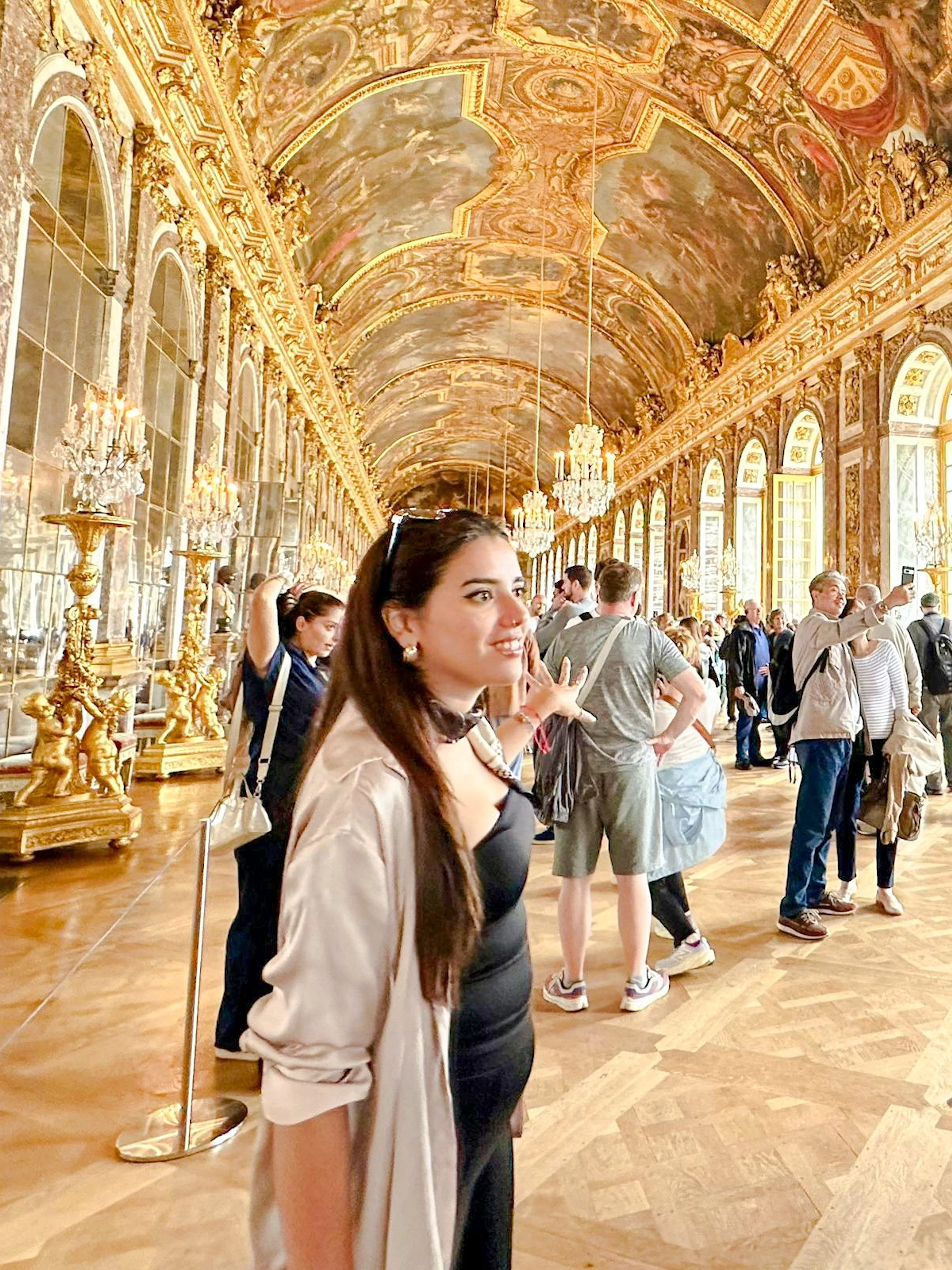 Visitors on a guided tour in the Hall of Mirrors, Palace of Versailles.