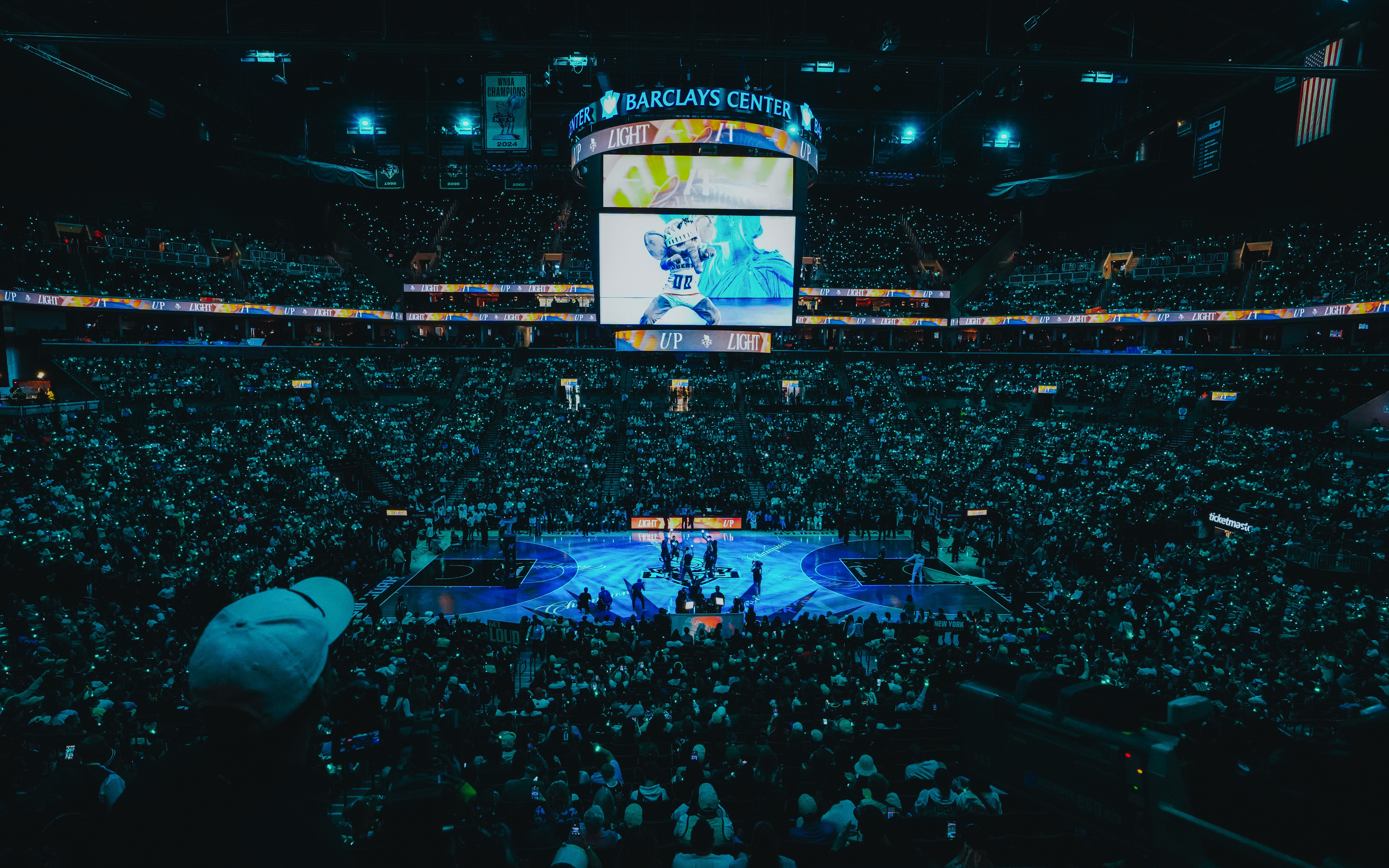 Aerial night view of New York Liberty basketball game at Barclays Center.
