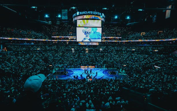Aerial night view of New York Liberty basketball game at Barclays Center.