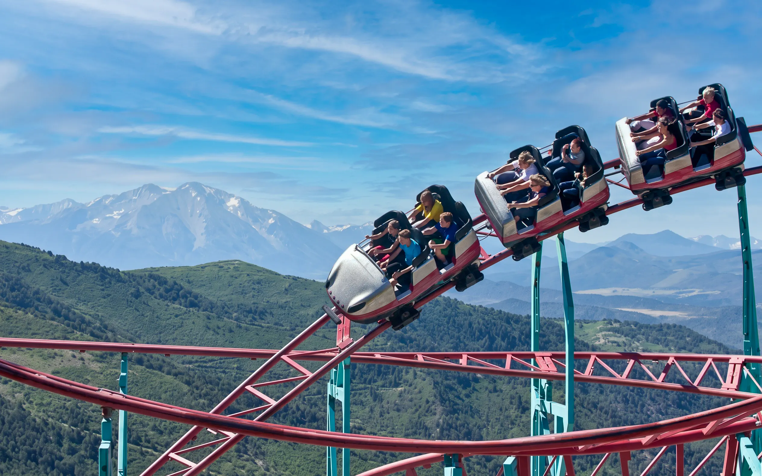Cliffhanger Roller Coaster at Glenwood Caverns Adventure Park with mountain views.
