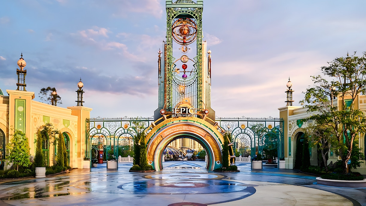 Entrance to Universal Epic Universe theme park with ornate archway and decorative elements.