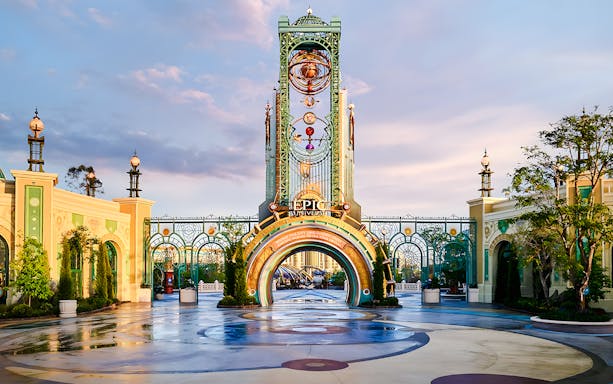 Entrance to Universal Epic Universe theme park with ornate archway and decorative elements.