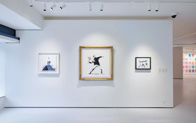 Banksy artworks displayed at Moco Museum London exhibition.