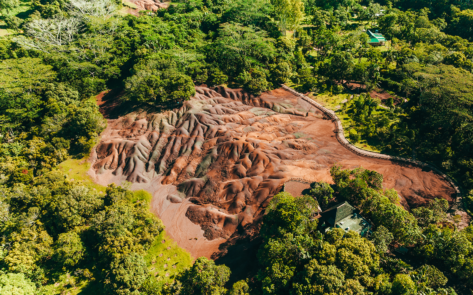 Chamarel 7 Coloured Earth geological formation surrounded by lush greenery in Mauritius.