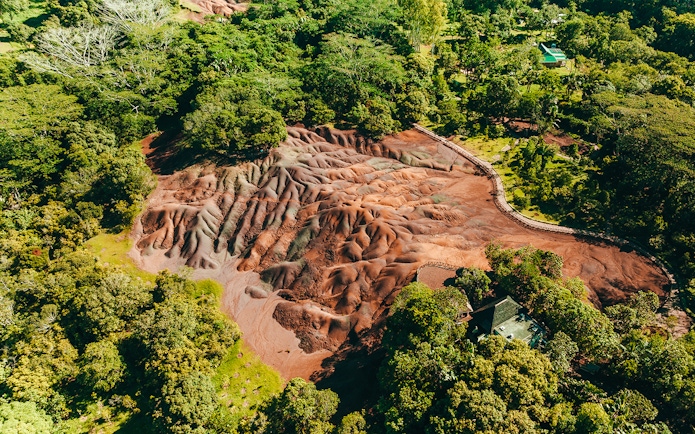 Chamarel 7 Coloured Earth geological formation surrounded by lush greenery in Mauritius.