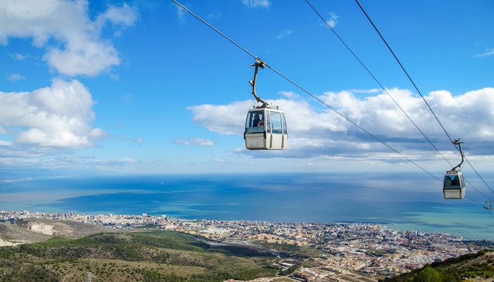 Cable car over Benalmadena with coastal view.