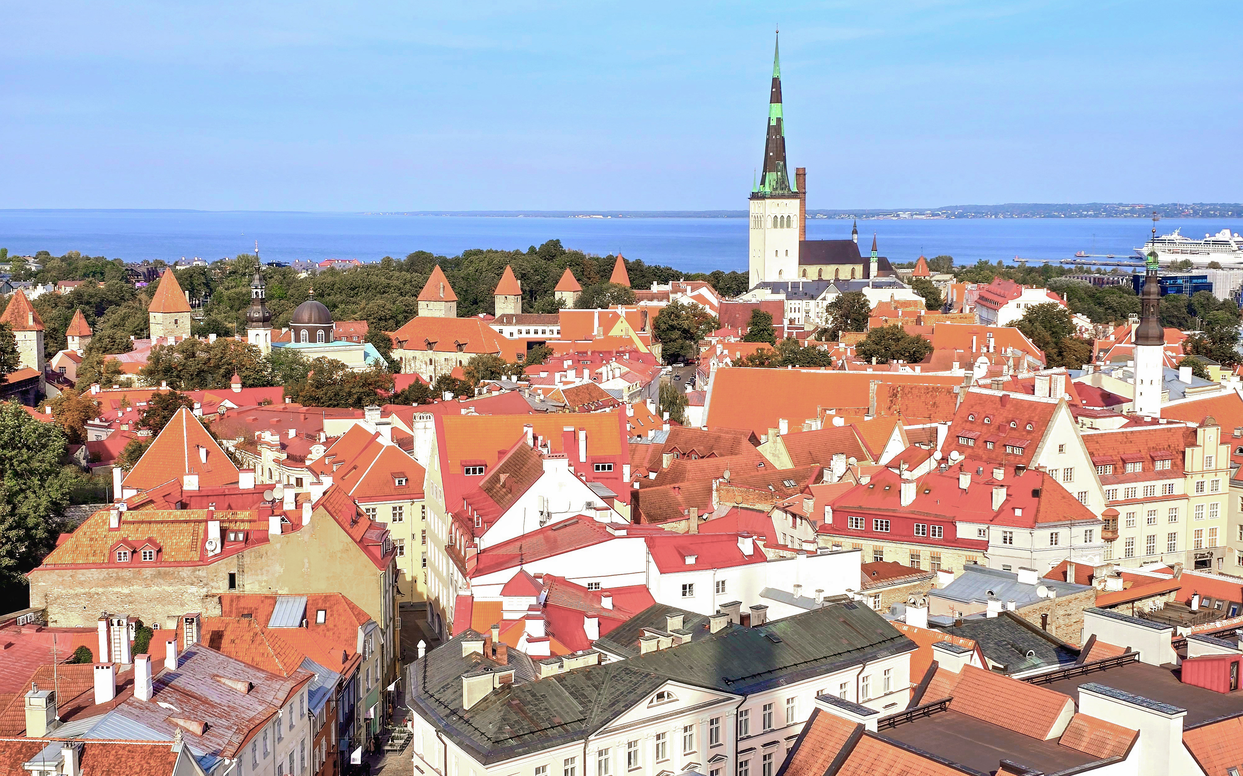 Tallinn's Old Town with red rooftops and St. Olaf's Church, view from Helsinki ferry trip.
