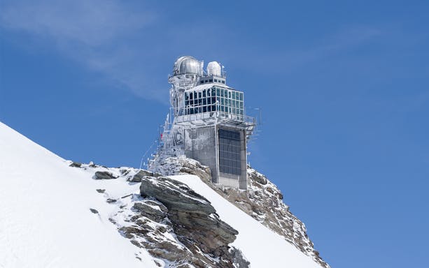 Jungfraujoch observatory on snowy peak, part of guided tour from Lucerne.
