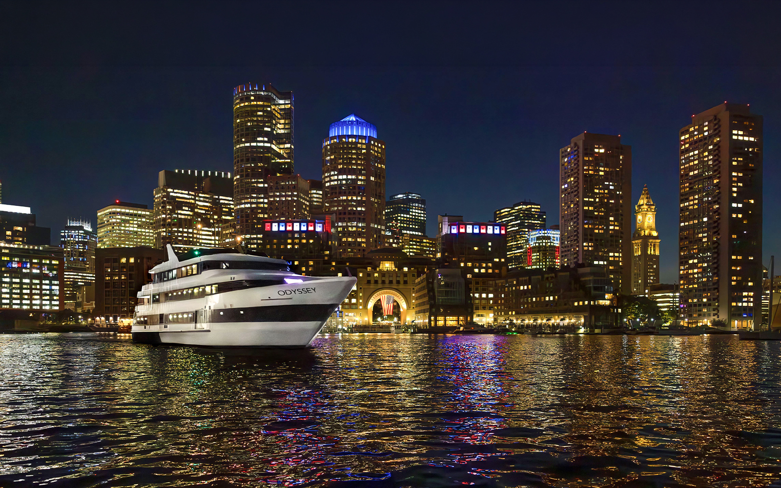 Premier Dinner Cruise ship on Boston Harbor with city skyline at night.