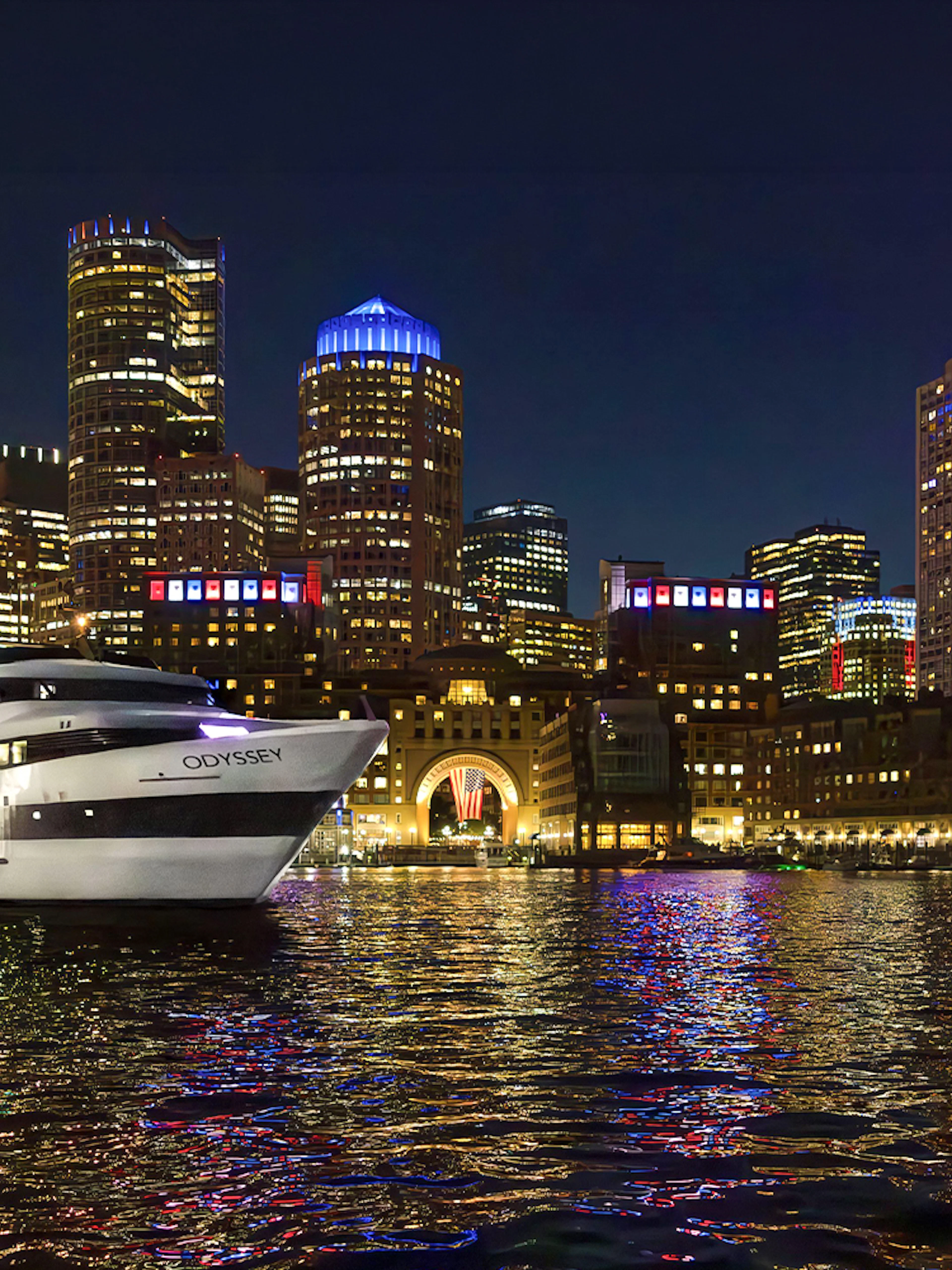 Premier Dinner Cruise ship on Boston Harbor with city skyline at night.