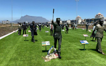 Statues at Long March to Freedom Exhibition with Table Mountain in the background, Cape Town.