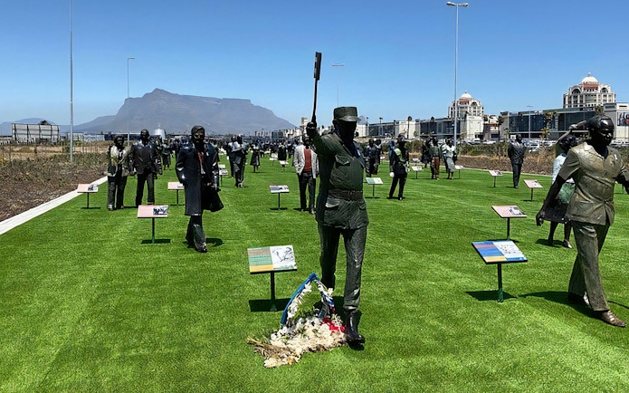 Statues at Long March to Freedom Exhibition with Table Mountain in the background, Cape Town.