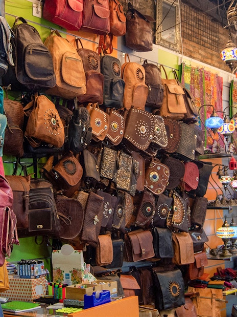 Leather bags and colorful lamps displayed at la Alcaicería, Arabic souk of Granada.