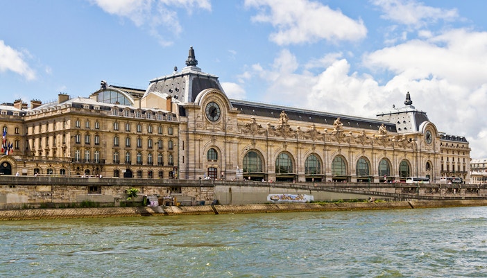 Tourists exploring art at the Orsay Museum in Paris, available with Fast-Track Tickets and access to Temporary Exhibitions