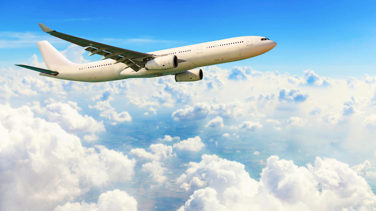 Airplane flying above clouds en route to Provence Airport.