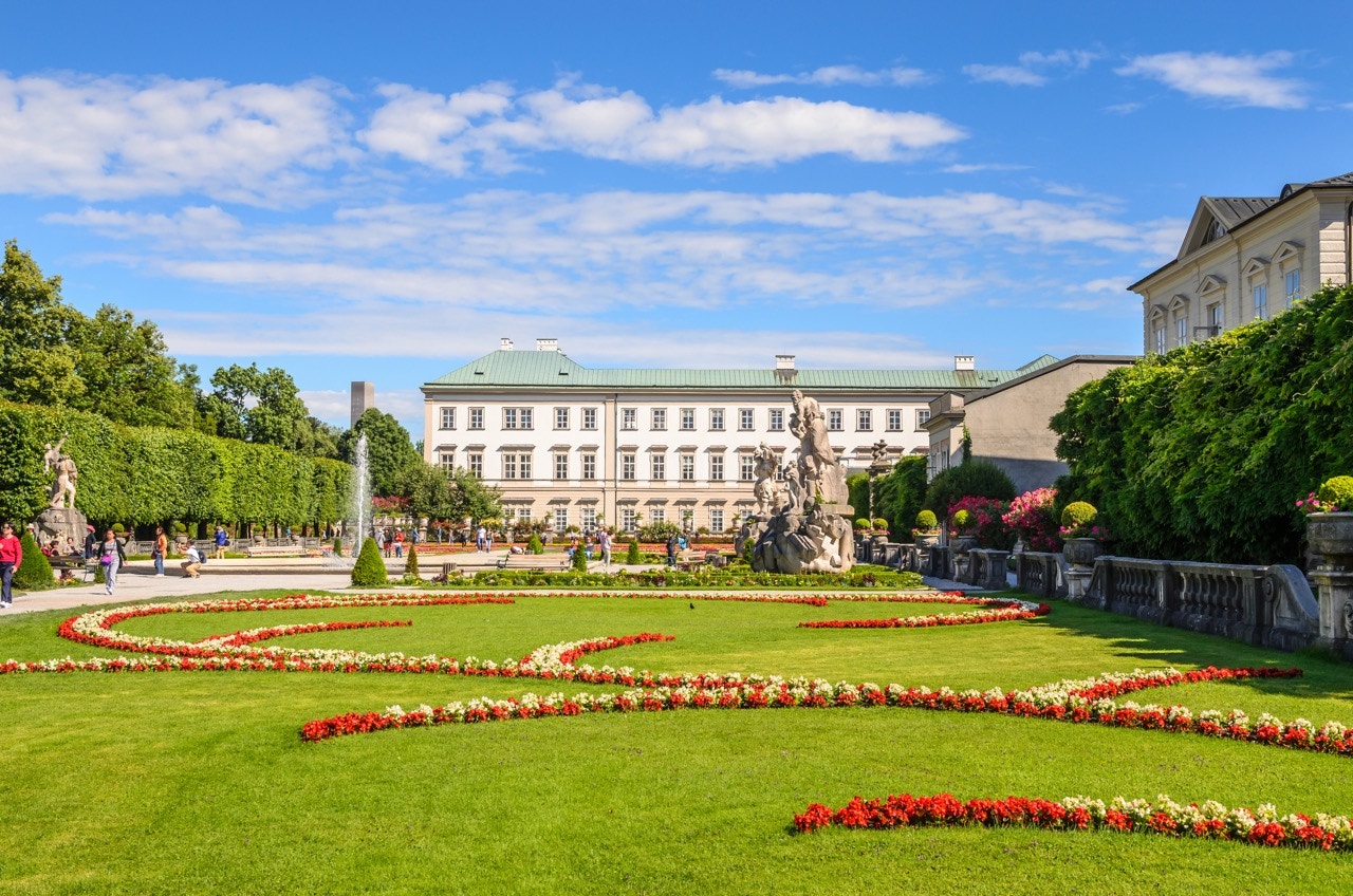 Mirabell Palace gardens with fountain and statues in Salzburg, Austria.