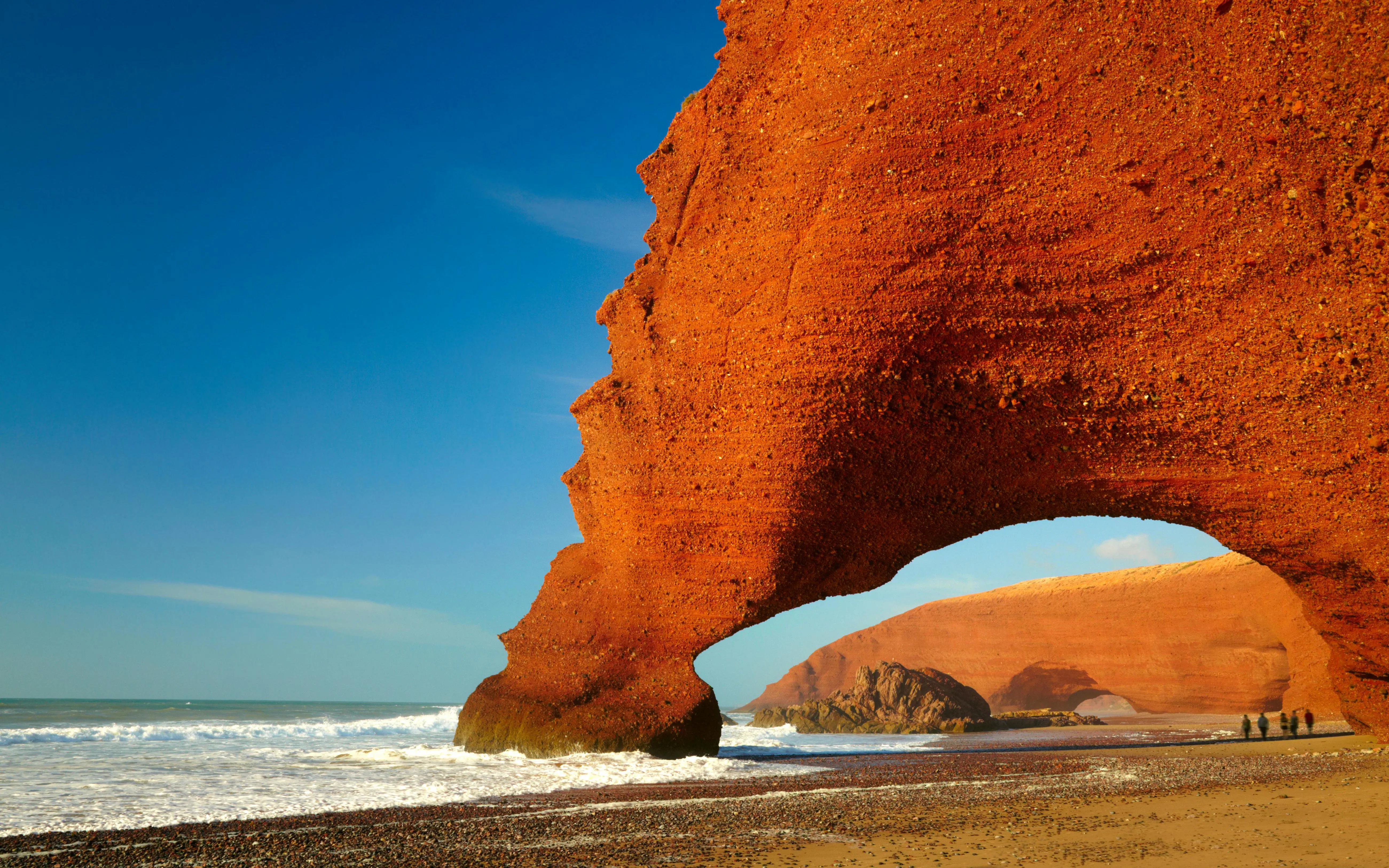 Red rock arch on Atlantic Ocean coast in Morocco.